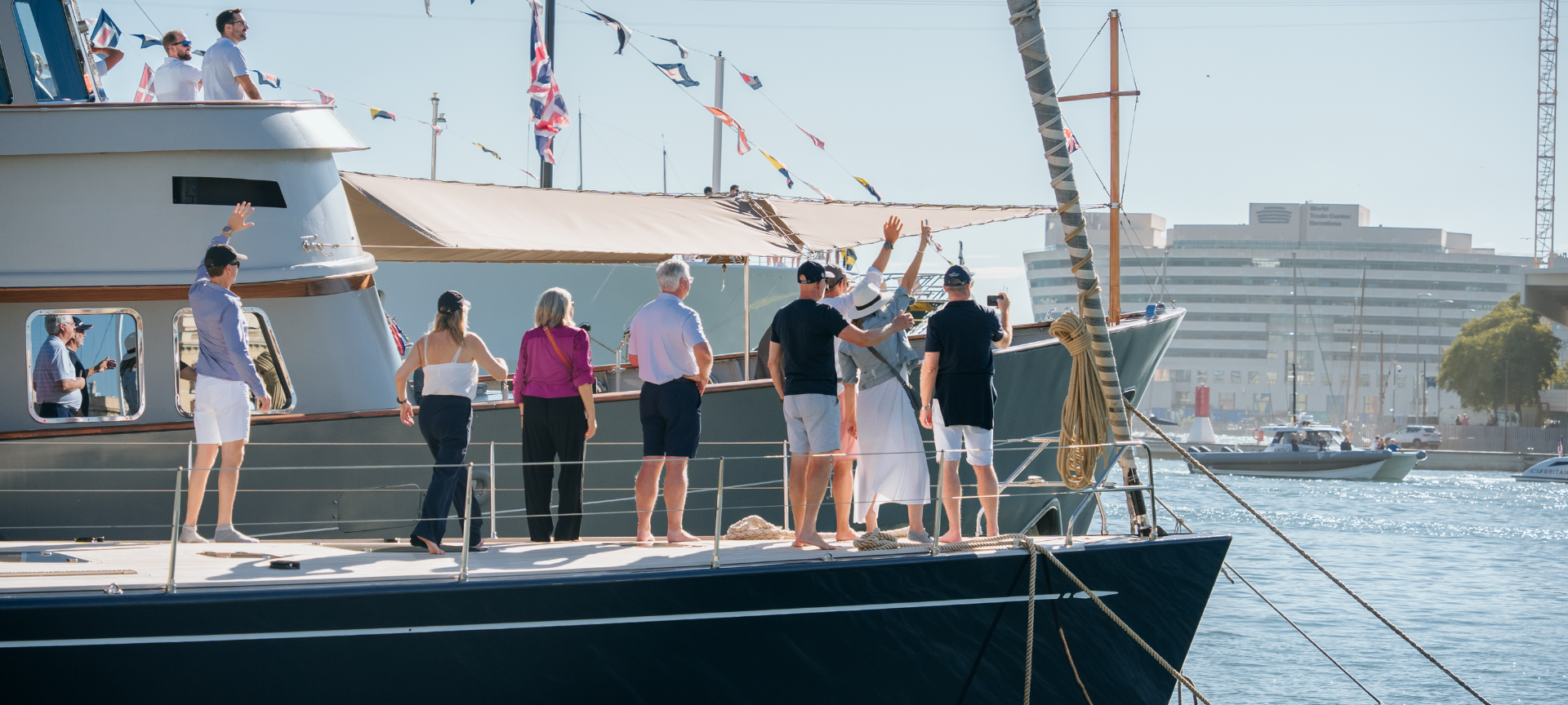 Spectators enjoying the America's Cup Barcelona 2024 from their superyacht.