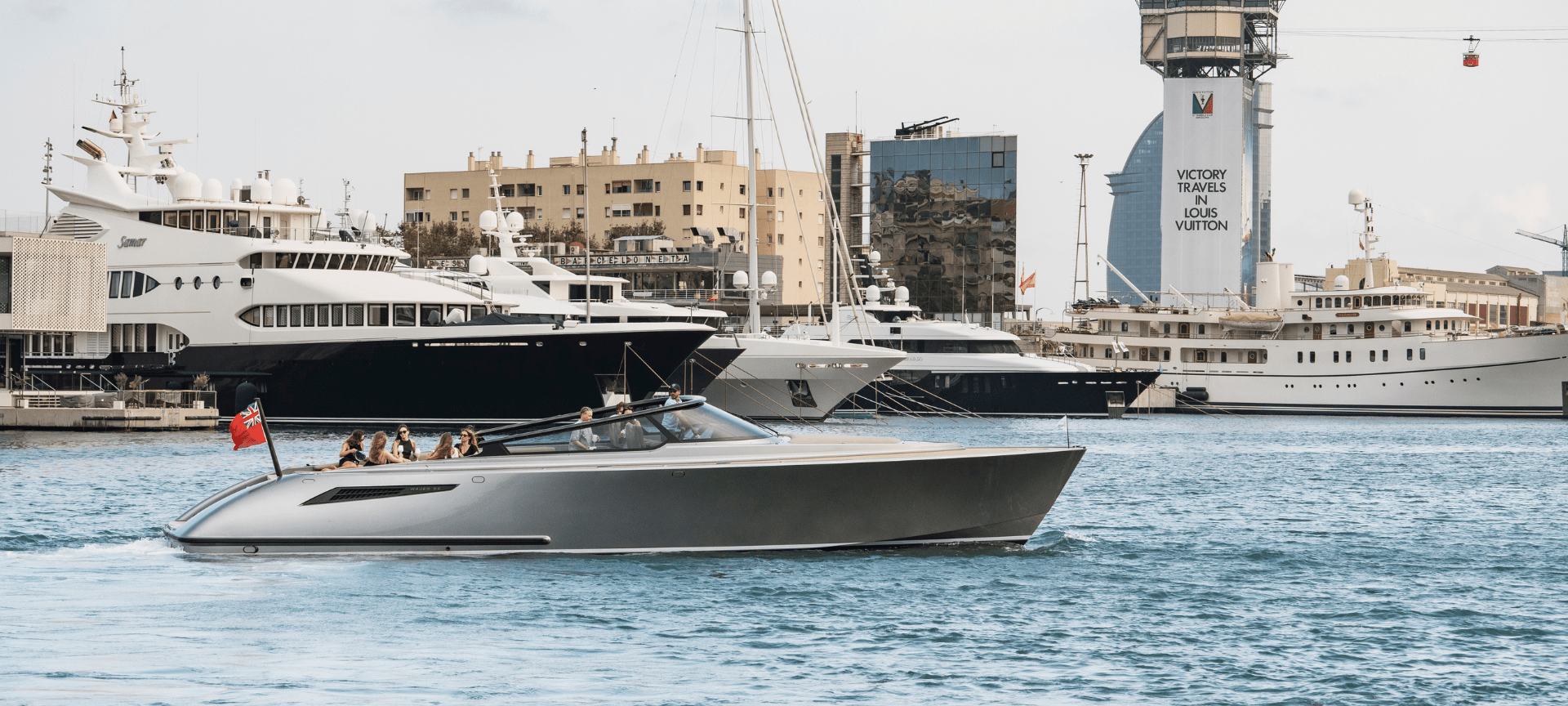 Superyacht sailing through Marina Port Vell
