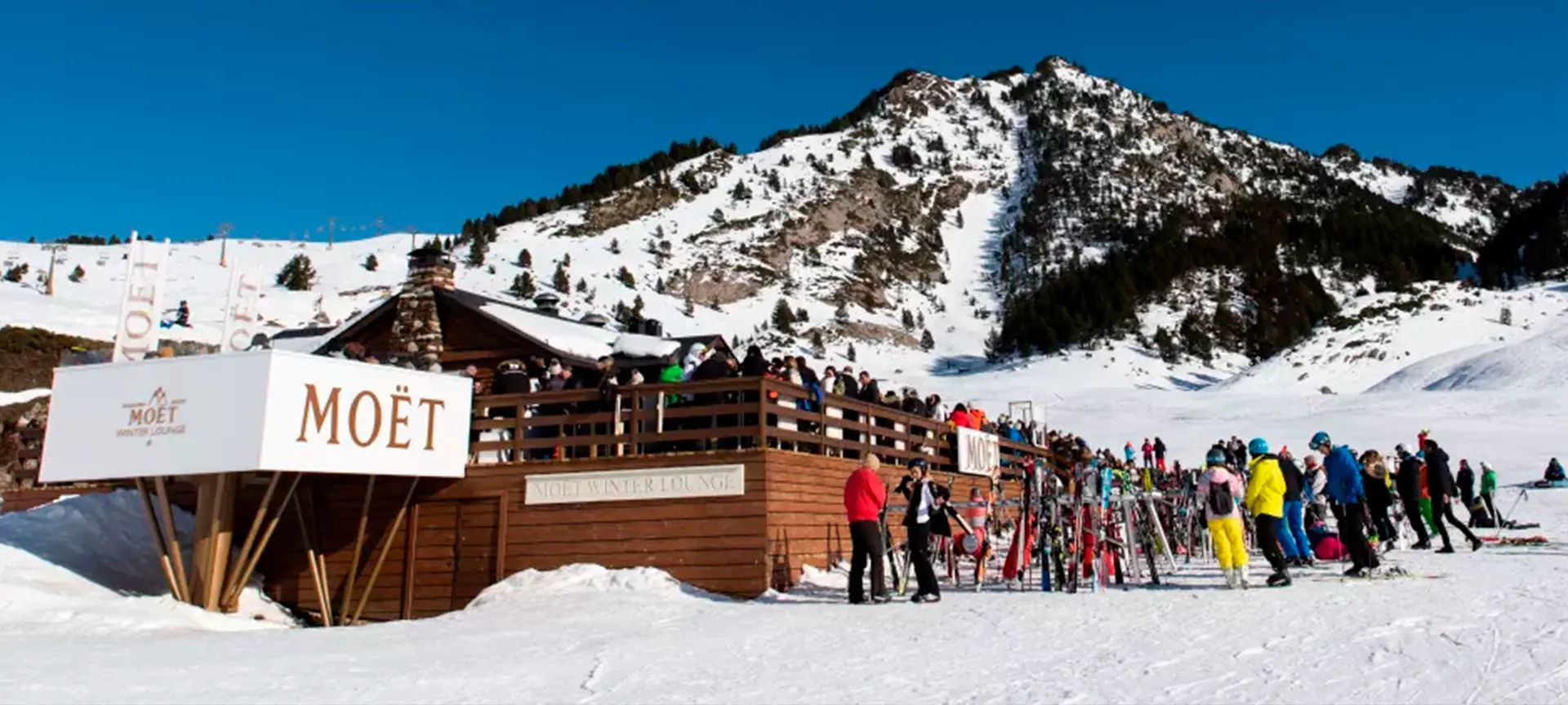 Panoramic view of Baqueira Beret ski resort in the Spanish Pyrenees, with skiers on the slopes