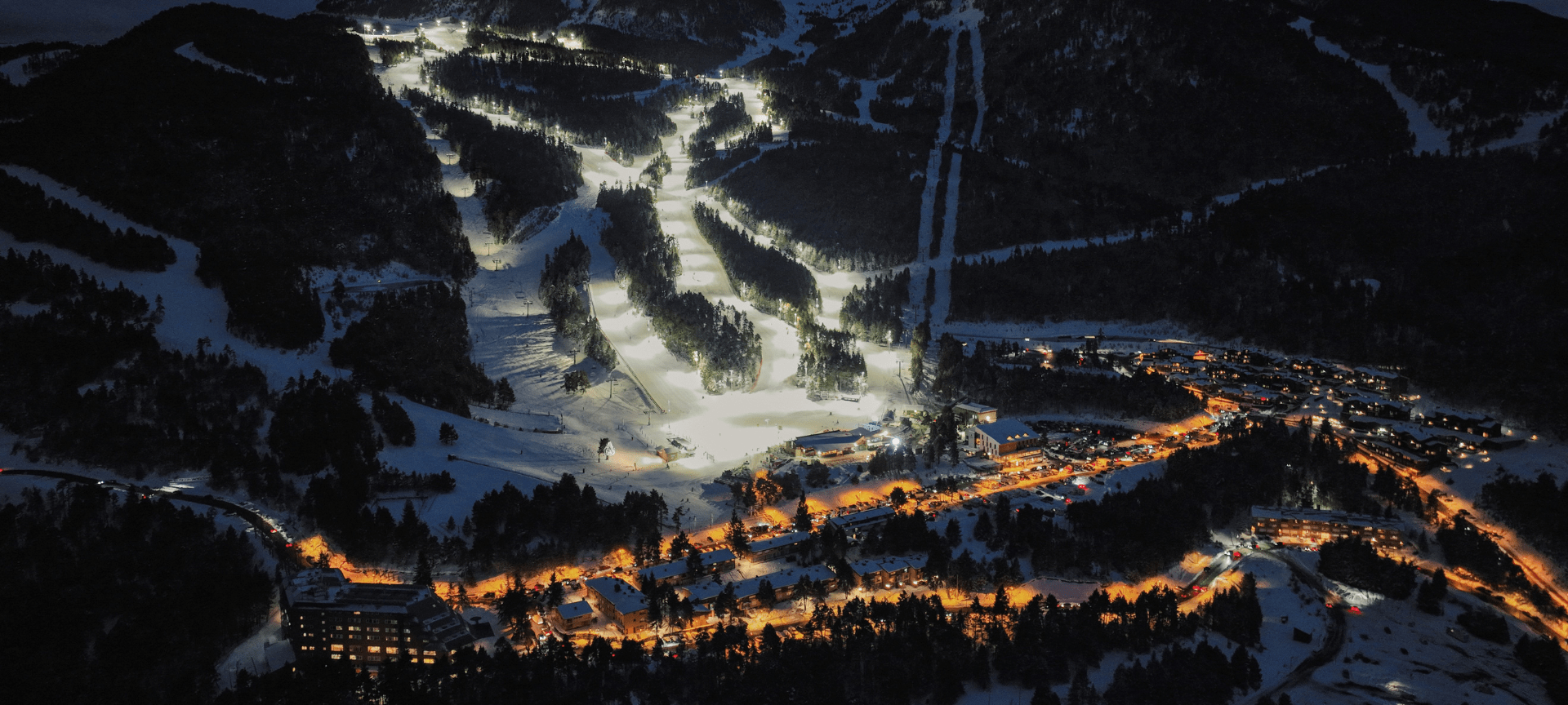 Skiers descending the slopes of Masella and La Molina, part of the Alp 2500 ski area in the Catalan Pyrenees
